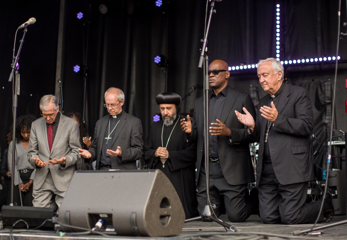 praying together on the stage